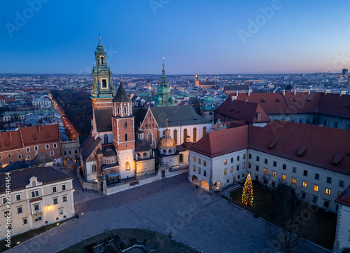 Wawel cathedral and castle with colorful illuminated Christmas tree, blue hour, Krakow, Poland