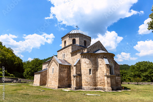 Historic stone church at Gradac Monastery under a blue summer sky, Serbia