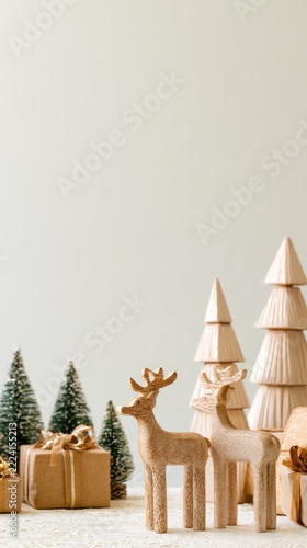Christmas wooden reindeer in snowy winter scene with copy space