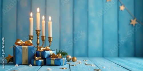 Stunning gold and blue Hanukkah presents on a light blue wooden backdrop with stars and lit candles , menorah, shine, faith