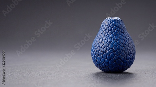 Stylized Blue Avocado-Shaped Fruit on a Dark Minimalist Background, Photorealistic Concept