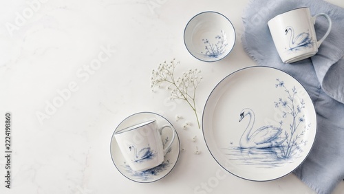 Swans decor design with elegant dishware arrangement, perfect for dining theme
