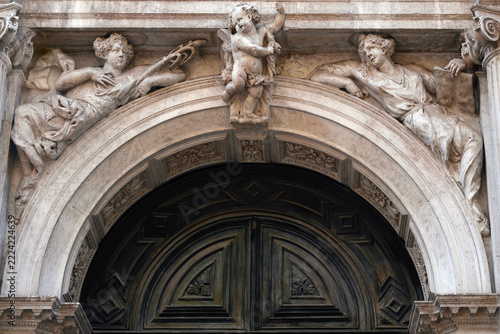 Carved portal above the entrance in Santa Maria del Giglio church. Venice, Italy