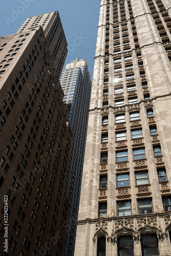 2019 New York City, USA; Low angle view of the historic neo-Gothic Woolworth Building skyscraper facade with Barclay Tower in Lower Manhattan