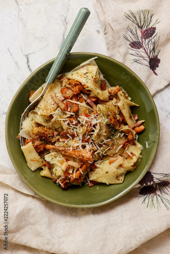 Homemade pasta with sauteed chanterelles, bacon, and Parmesan