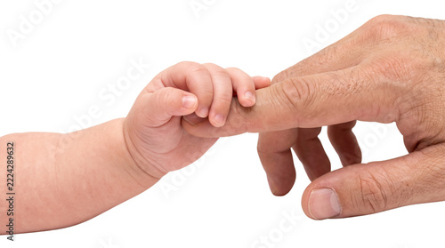 Baby holding an adult’s finger
