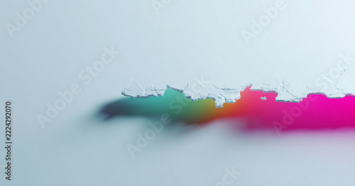 Colorful paint peeling on white surface