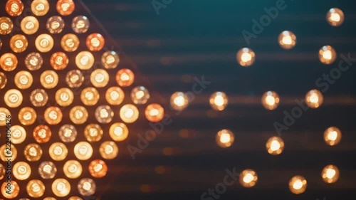 Arrow shape formed by glowing light bulbs pointing forward representing direction and leadership concept
