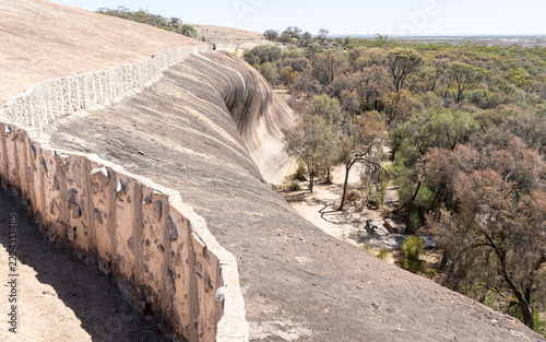Wall above Wave Rock to funnel rain water into a drinking water storage dam on the Hayden Rock Walk in Western Australia, Australia