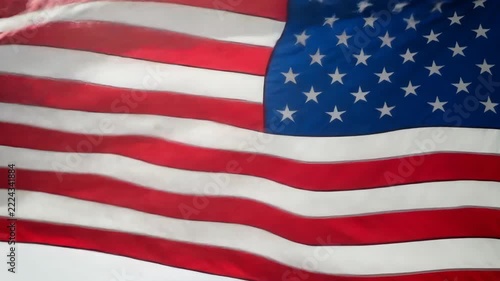 Waving American Flag Close-Up with Red, White, and Blue Stripes and Stars.