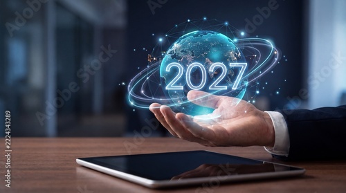 Businessman presents a rising digital chart with 2027 forecast, representing financial growth, market performance, investment strategy, economic outlook and future business success.