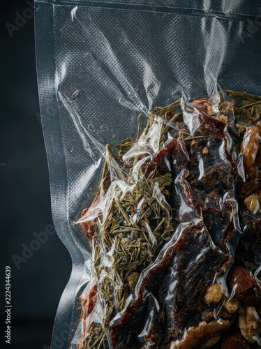 Vacuum seal bag containing dried herbs and spices, showcasing freshness and preservation