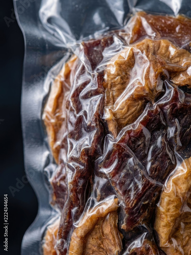 Vacuum seal bag containing dried meat, showcasing texture and preservation