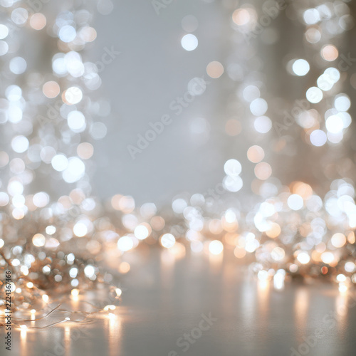 Christmas background, Christmas background of blurred garland lights in silver and white, elegant cinematic lighting, bokeh concentrated at the edges