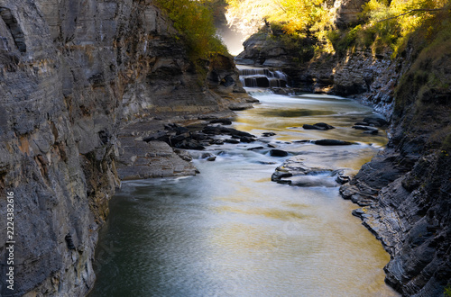 Letchworth State Park Waterfall in Autumn with Sunlight and Mist, New York