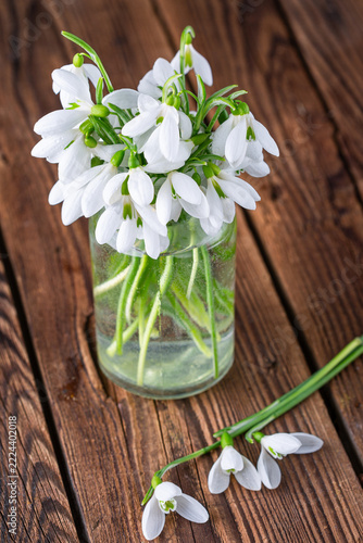 
a bouquet of snowdrops in a glass vase