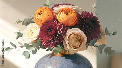Sophisticated floral arrangement with orange ranunculus and purple