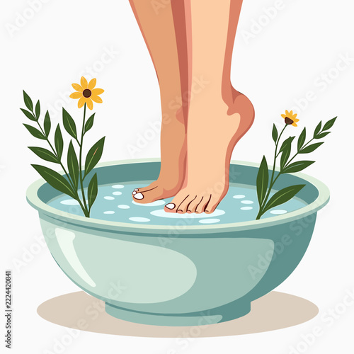 Female feet in spa water bowl with yellow flowers and leaves