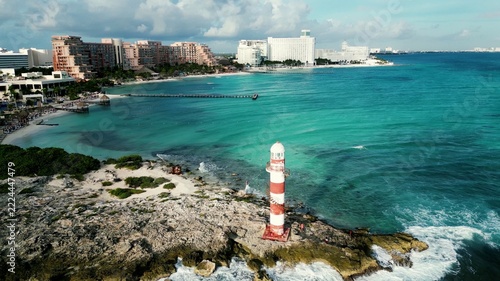 Aerial view of lighthouse and developed coastline in Mexico