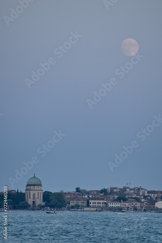 Votive Temple of Peace at sunset with a full moon