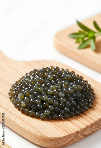 Luxury caviar on wooden spoon, gourmet food and fine dining concept, premium seafood delicacy for culinary events and high-end restaurant menu