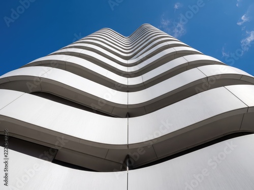 Modern architectural building with sleek curved white and gray