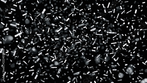 A bunch of colorful confetti sprinkles on a black and white background