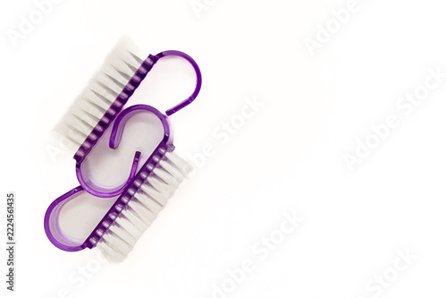 Lilac brushes on a white background for manicure work. Space for text.