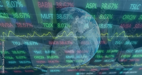 Showing market overlay over office table featuring laptop yellow chart, globe pair in formal attire