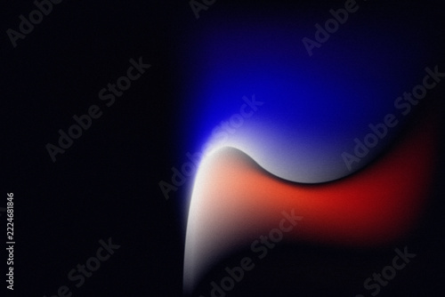 Abstract background with smooth flowing waves of blue and red light gradients on a dark black surface