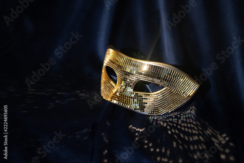 Golden Mirrored Venetian Masquerade Men’s Mask on Black Fabric, Luxury Carnival Accessory.Golden Mirrored Venetian Masquerade Men’s Mask on Black Fabric, Luxury Carnival Accessory.