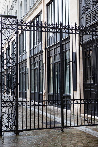 Wrought iron security gate in a Parisian passageway