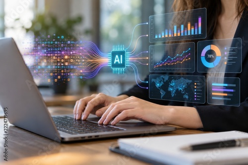 Hands operating a laptop beneath analytical charts linked through an intellig...