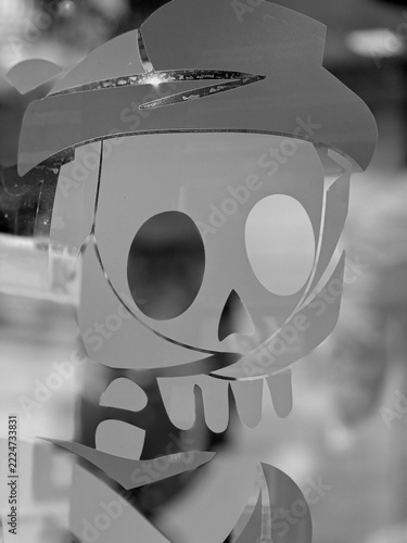 Stylized skull decal on glass