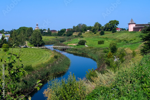  A picturesque summer view of the Suzdal Kremlin and the winding Kamenka River in Suzdal, Vladimir Oblast, Russia, part of the historic Golden Ring of Russia