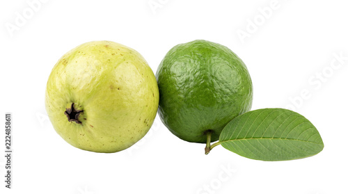 Pair of yellow and green guava fruits with a single leaf on white background, tropical fruit, psidium guajava