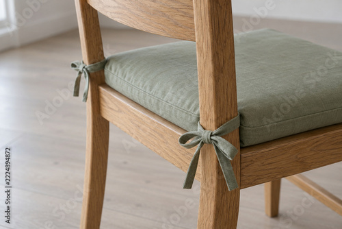 Cushion Tied to the Rear Posts of a Wooden Dining Chair