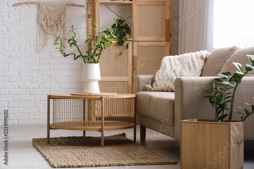 Interior design and home comfort, cozy living room with beige sofa and house ...