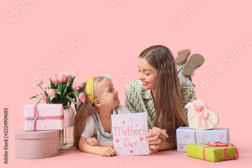 Mothers day celebration, happy mother and daughter with handmade greeting car...
