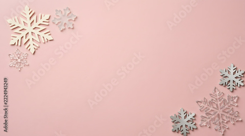 Christmas snowflake border frame on pink background for winter holiday greeting card design layout