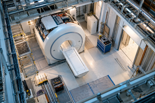 Unbranded MRI equipment showing mri room from above drone view in a modern hospital radiology installation environment with no people. Medical technology image created with Generative AI.