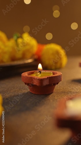 Traditional Clay Diya Filled with Melted Ghee and Lit with a Cotton Wick, Glowing Warm Flame Close-Up for Puja and Diwali