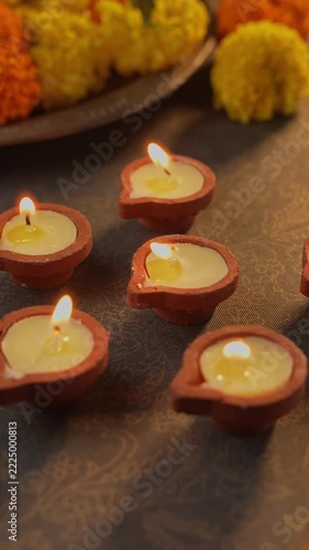 Traditional Clay Diya Filled with Melted Ghee and Lit with a Cotton Wick, Glowing Warm Flame Close-Up for Puja and Diwali