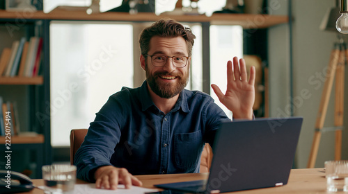 Man_making_video_call_on_laptop