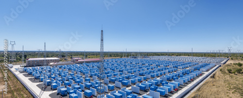 Aerial Panorama of Large Battery Energy Storage Station Under Blue Sky