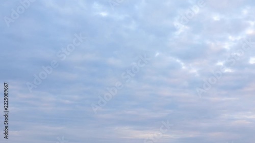 Time lapse panoramic view of overcast sky with drifting clouds moving across low horizon at dawn over open outdoor skyline