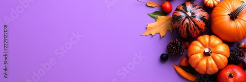 Vibrant Autumn Bounty: Pumpkins, Leaves, and Pinecones on a Purple Background