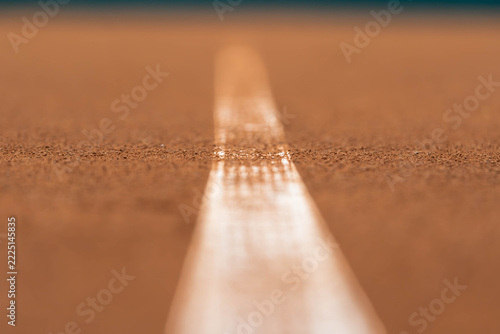 White Court Line on Clay Tennis Court with Shallow Depth of Field