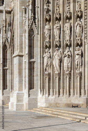 Ornate stone portal at Votivkirche (Votive Church) with statues of saints, Vienna, Austria