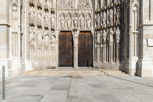 Ornate stone portal at Votivkirche (Votive Church) with statues of saints, Vienna, Austria